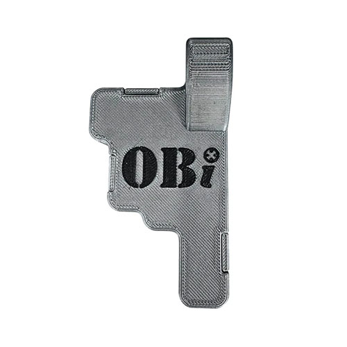 OBi Trigger Case on 3D-tulostettu, kompakti säilytysrakenne vara-iskunappulalle, joka mahtuu helposti laukkuusi ilman turhaa tilan käyttöä.